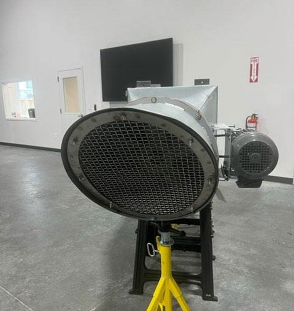 Photo of supply and exhaust fans on a roof of a commercial building in Texas. 